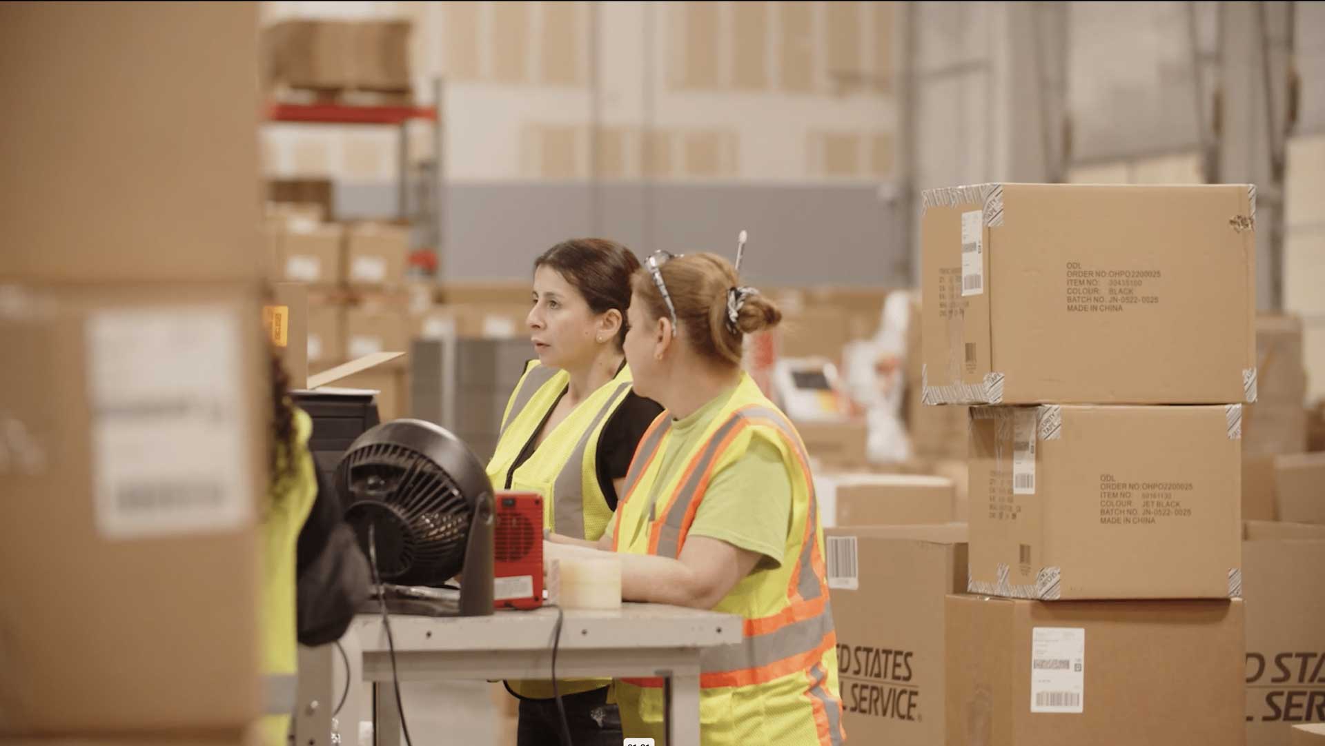 omnichannel fulfillment-center employees packing orders